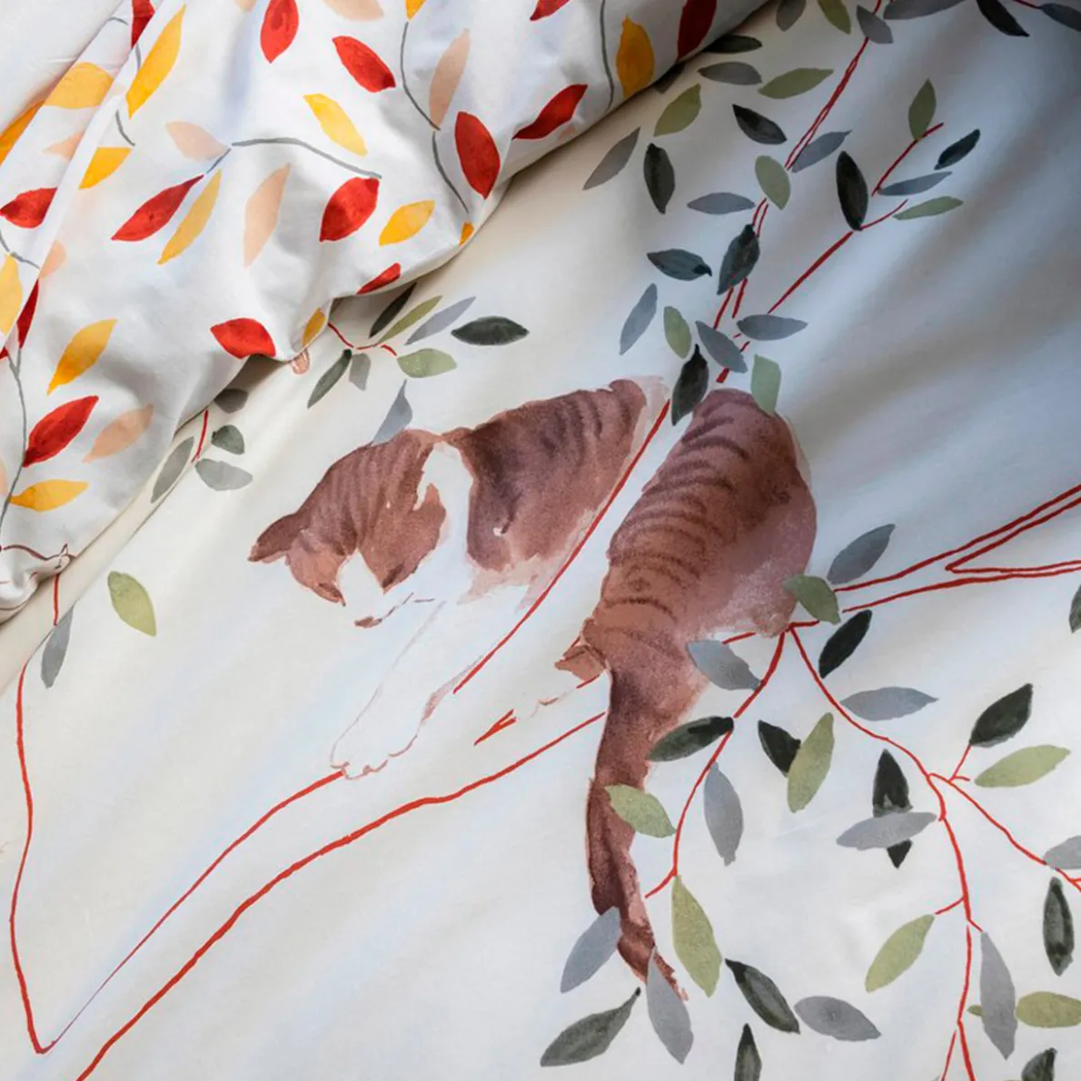 Chats sur la branche Linge de lit